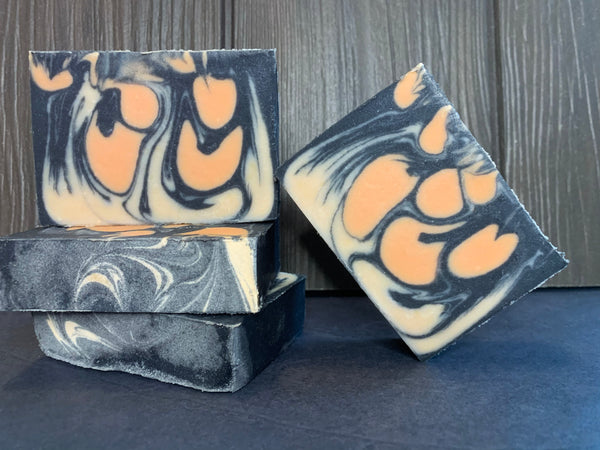 handmade soap with essential oil grapefruit essential oil rosemary essential oil activated charcoal beer soap handmade in Texas with conundrum grapefruit ipa from walking stick brewing company Houston Texas craft brewery black orange and tan beer soap spunkndisorderly craft beer soaps