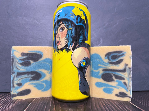 Martin house brewing company electric lemonade beer Can with anime-style artwork between two bars of beer soap on a dark surface with a stone background