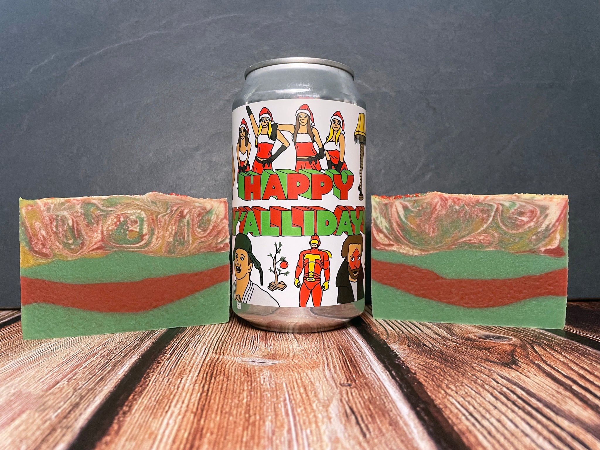 prairie artisan ales happy y'allidays beer can between two bars of red white green beer soap bars on a wooden surface