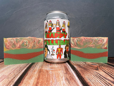 prairie artisan ales happy y'allidays beer can between two bars of red white green beer soap bars on a wooden surface