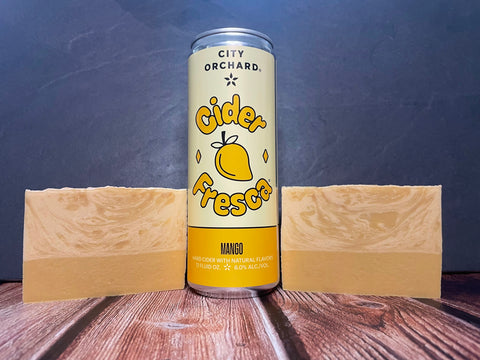 city orchard mango cider fresca can between two bars of cream and gold cider soap by spunkndisorderly on a wooden surface
