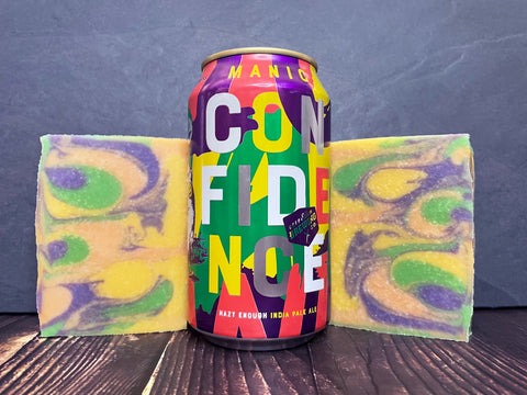 Deep Ellum Brewing Co. manic confidence beer can between two bars of ipa beer soap on a wooden surface