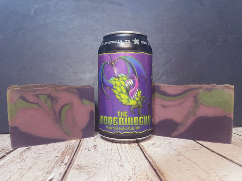 purple and green beer soap bars beside the jabberwocky imperial ipa beer can on wooden surface