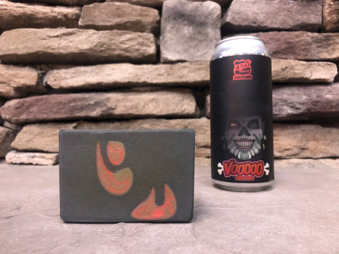 450 north brewing company voodoo fruit punch beer can beside a bar of grey red and black beer soap