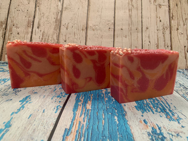 pink and orange seltzer soap handmade in texas with sparkly boi: cotton candy craft seltzer from ingenious brewing company humble texas craft brewery orange and pink cider soap topped with sugar sprinkles spunkndisorderly
