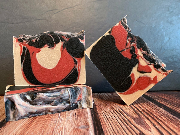 artisan soap handmade in texas with big black cowbell hoppy imperial stout craft beer from buffalo bayou brewing co black red and white craft beer soap with activated charcoal spunkndisorderly
