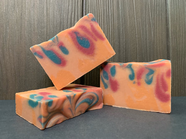 beer soap with lavandin essential oil orange beer soap with pink and blue swirls floral beer soap for her handcrafted by spunkndisorderly beer soaps with blooming bliss hazy pale ale from barebottle brewing company California craft brewery